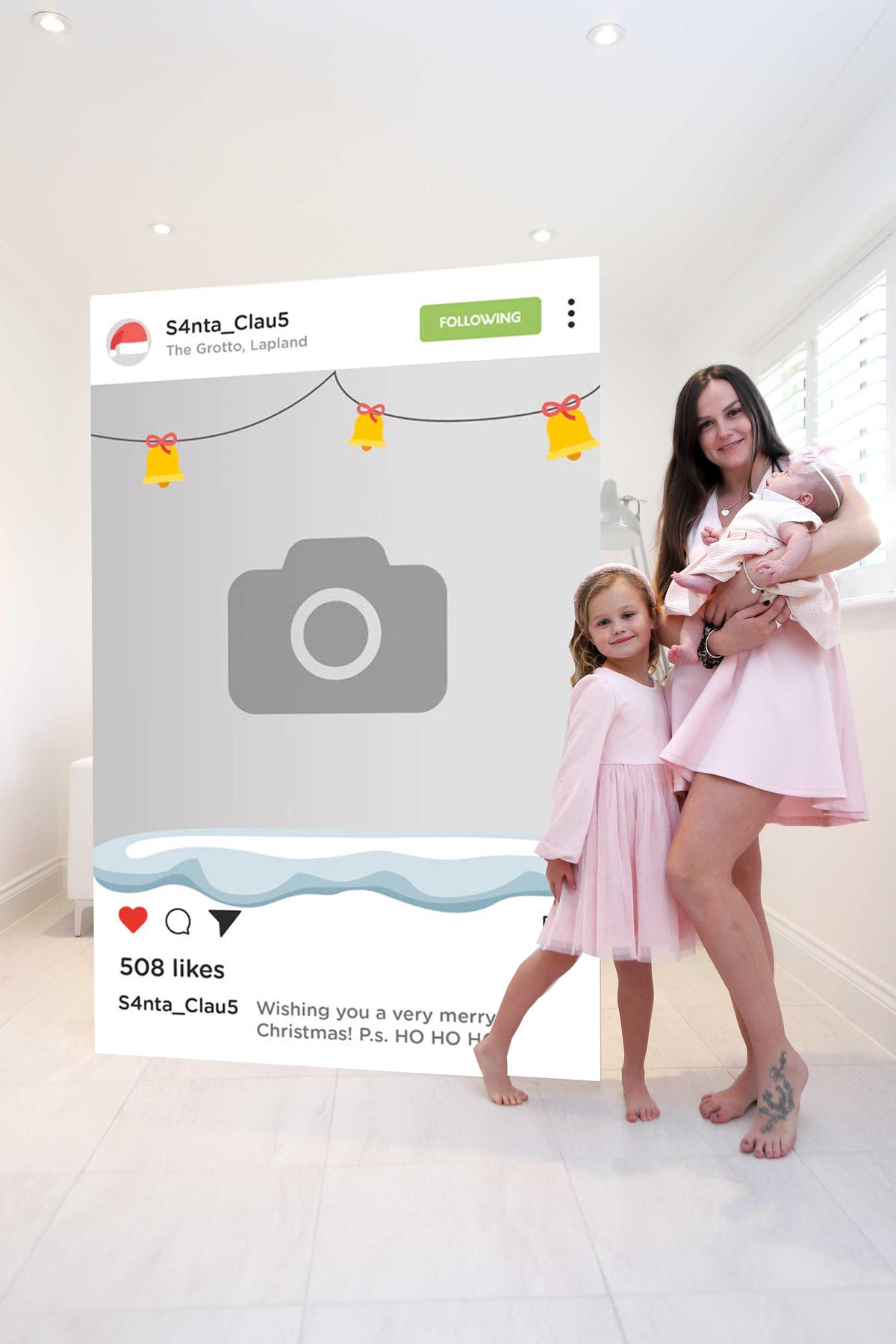 mother and 2 daughters posing with giant Christmas Instagram Style Card